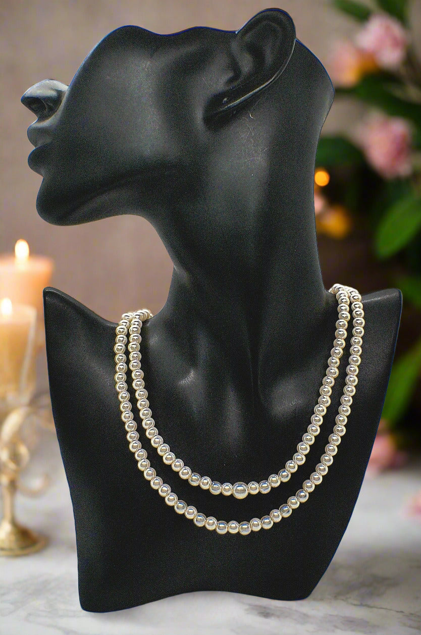 https://www.artistryjewelry.net/products/beautiful-light-peach-stardust-and-pearl-two-strand-beaded-necklace-handcrafted-by-artistry-jewelry
