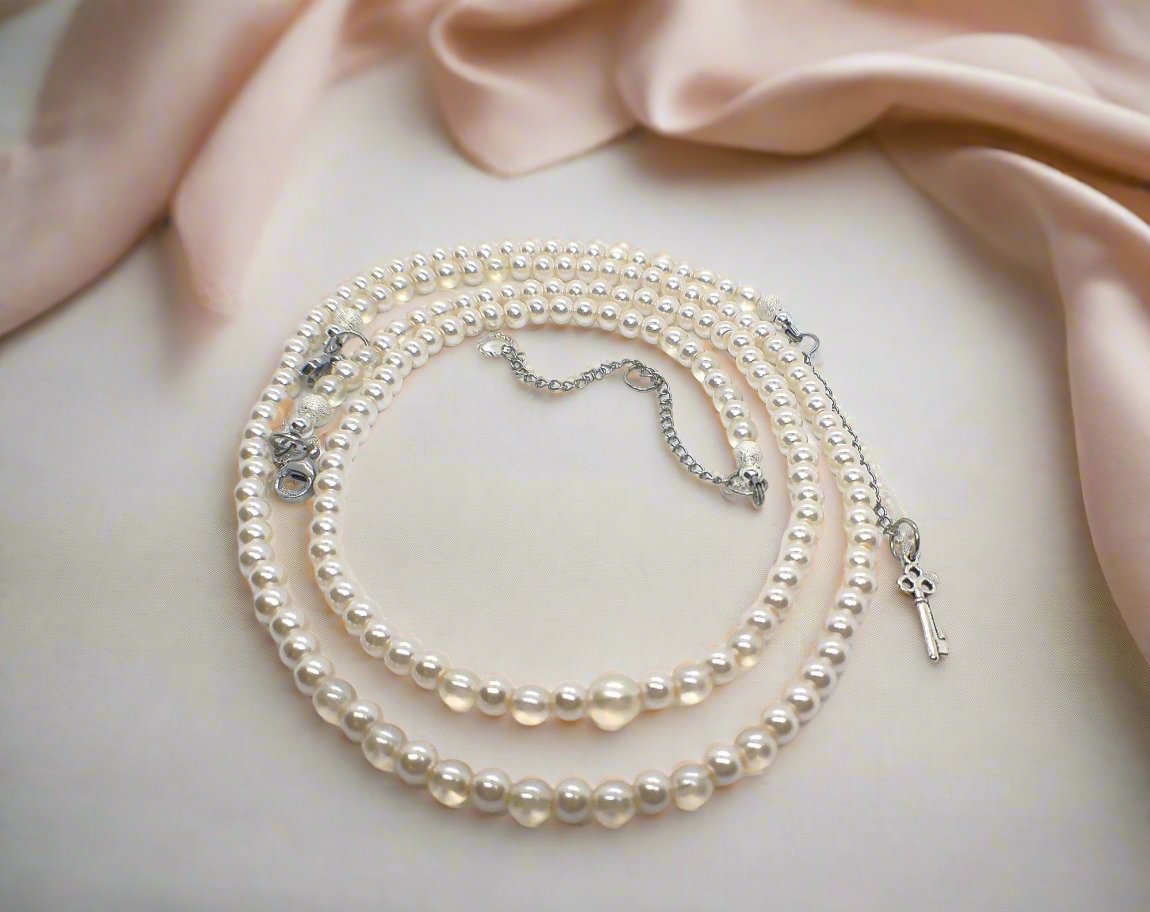 https://www.artistryjewelry.net/products/beautiful-light-peach-stardust-and-pearl-two-strand-beaded-necklace-handcrafted-by-artistry-jewelry