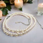 https://www.artistryjewelry.net/products/beautiful-light-peach-stardust-and-pearl-two-strand-beaded-necklace-handcrafted-by-artistry-jewelry