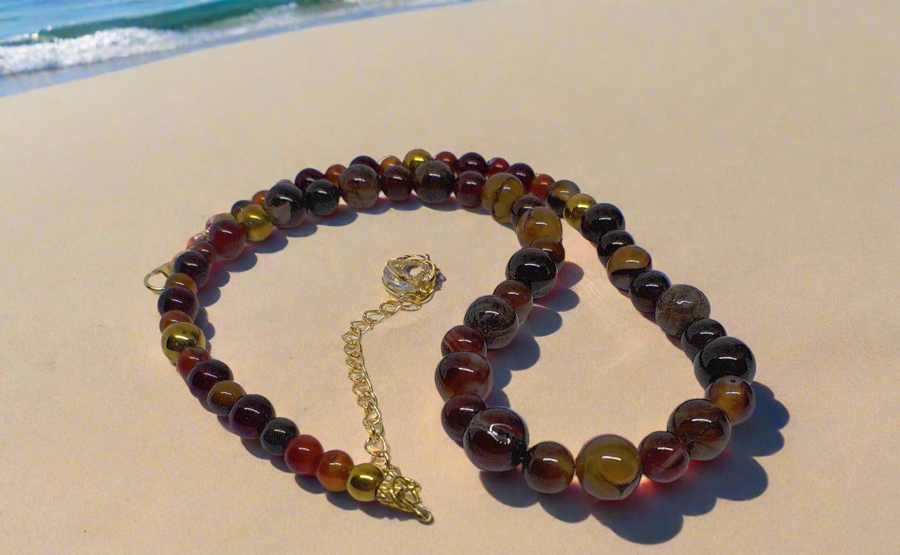 https://www.artistryjewelry.net/products/alluring-carnelian-round-agate-and-hematite-beaded-nacklace