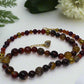 https://www.artistryjewelry.net/products/alluring-carnelian-round-agate-and-hematite-beaded-nacklace