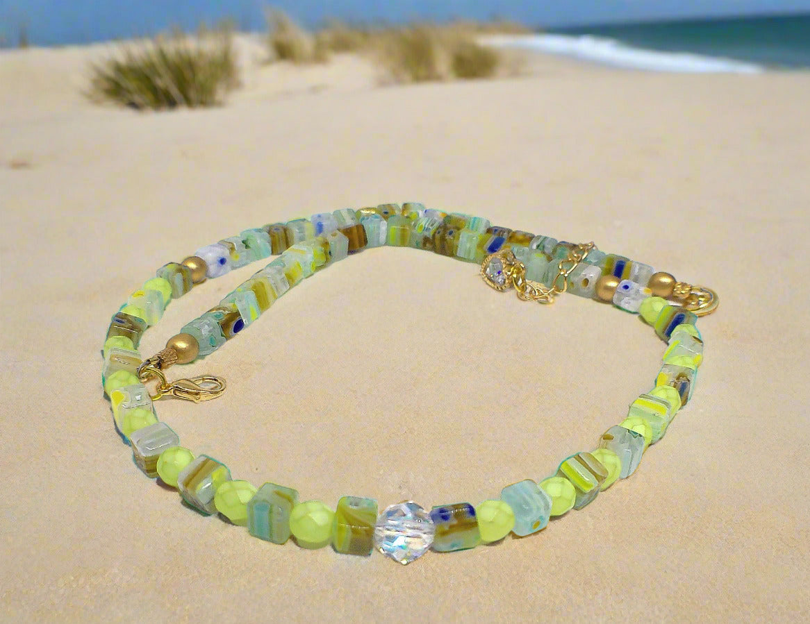 https://www.artistryjewelry.net/products/charming-green-and-gold-beaded-necklace-by-artistry-jewelry
