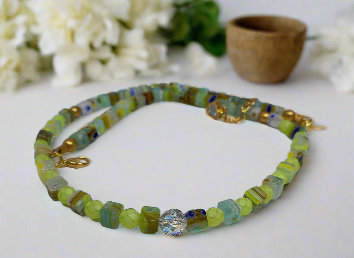 https://www.artistryjewelry.net/products/charming-green-and-gold-beaded-necklace-by-artistry-jewelry