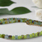https://www.artistryjewelry.net/products/charming-green-and-gold-beaded-necklace-by-artistry-jewelry