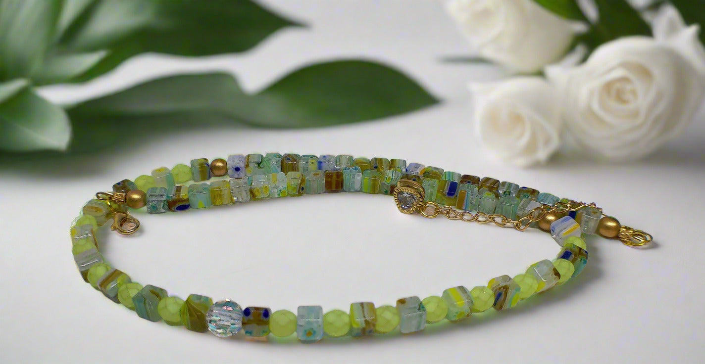 https://www.artistryjewelry.net/products/charming-green-and-gold-beaded-necklace-by-artistry-jewelry