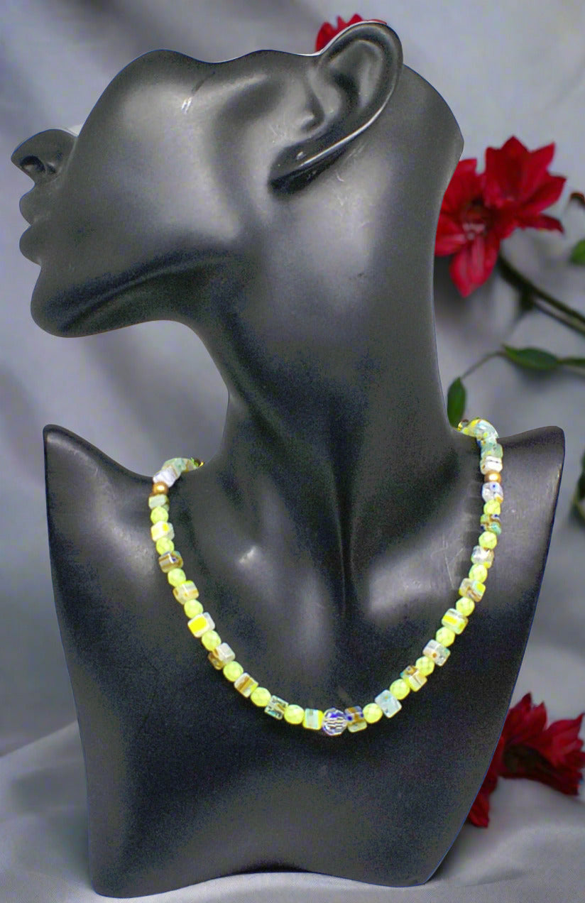 https://www.artistryjewelry.net/products/charming-green-and-gold-beaded-necklace-by-artistry-jewelry