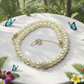 Alluring Ivory, Gold and Crystal Necklace