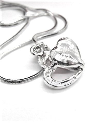 https://www.artistryjewelry.net/products/red-crystal-heart-necklace