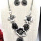 https://www.artistryjewelry.net/products/black-and-silver-flower-necklace-set
