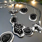https://www.artistryjewelry.net/products/black-and-silver-flower-necklace-set