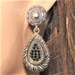 https://www.artistryjewelry.net/products/silver-swirl-earrings
