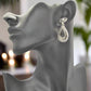https://www.artistryjewelry.net/products/silver-swirl-earrings