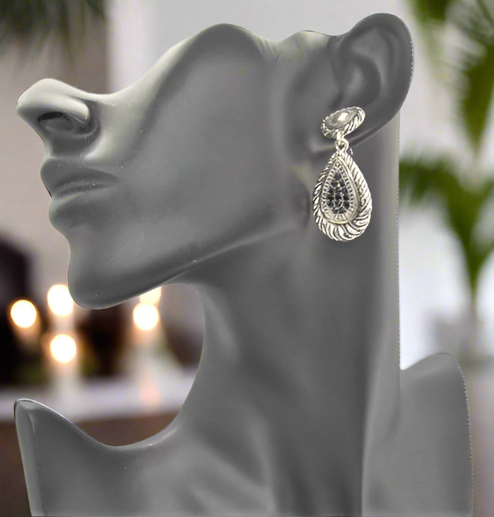 https://www.artistryjewelry.net/products/silver-swirl-earrings