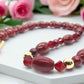 https://www.artistryjewelry.net/products/lovely-burgundy-surprise-necklace