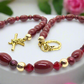 https://www.artistryjewelry.net/products/lovely-burgundy-surprise-necklace