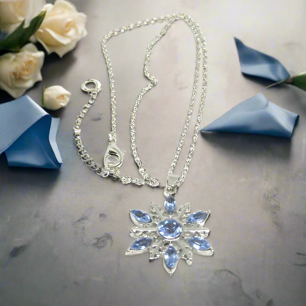 https://www.artistryjewelry.net/products/lovely-blue-winter-snowflake-necklace
