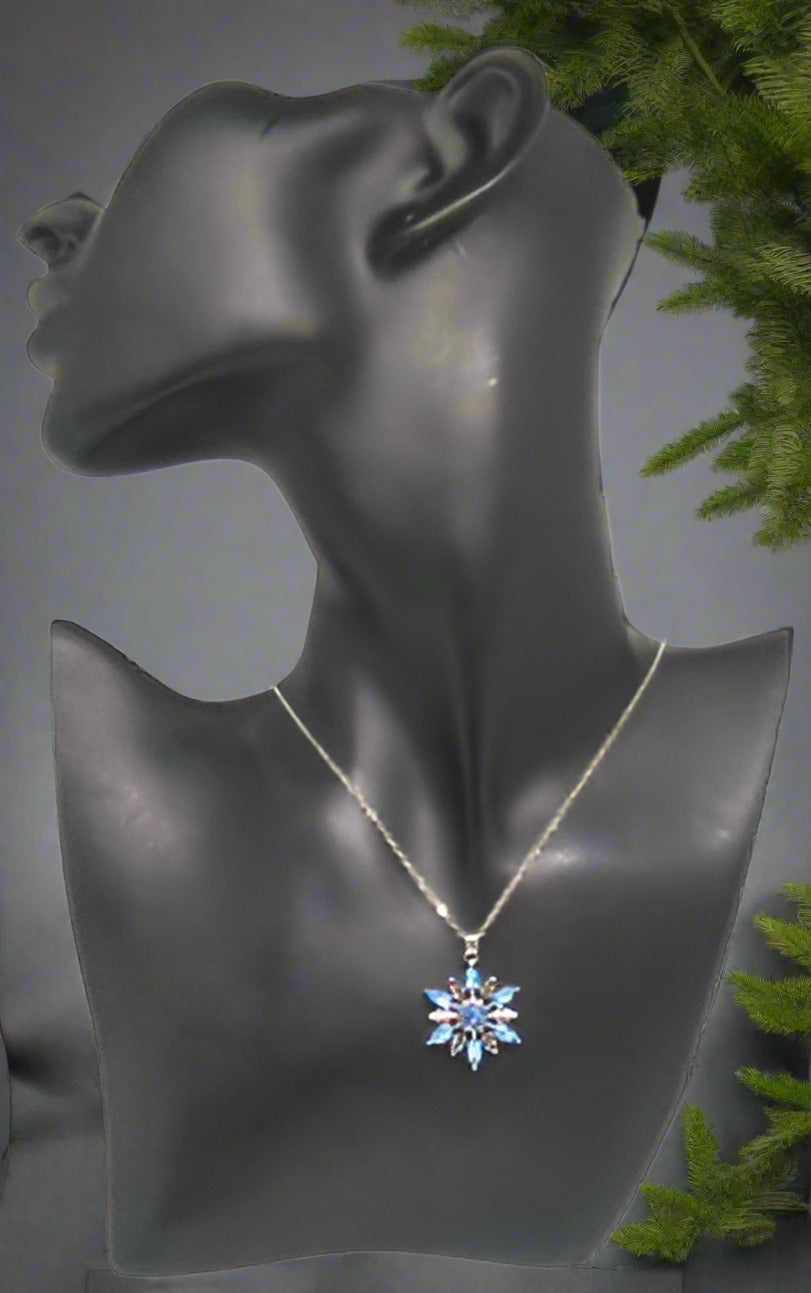 https://www.artistryjewelry.net/products/lovely-blue-winter-snowflake-necklace