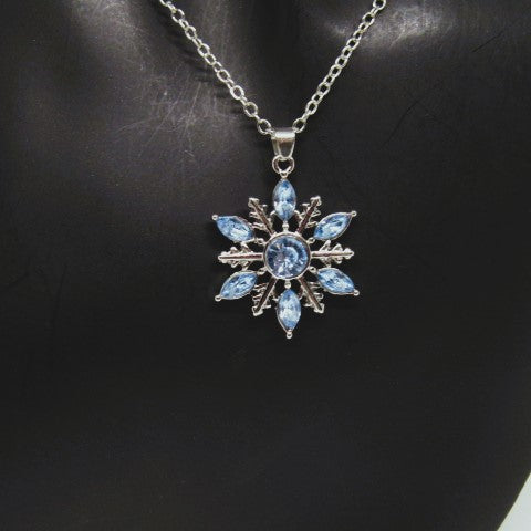 https://www.artistryjewelry.net/products/lovely-blue-winter-snowflake-necklace