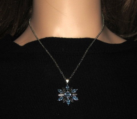 https://www.artistryjewelry.net/products/lovely-blue-winter-snowflake-necklace