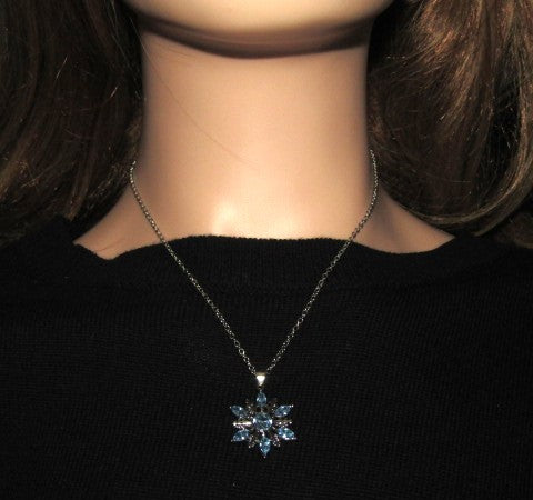 https://www.artistryjewelry.net/products/lovely-blue-winter-snowflake-necklace