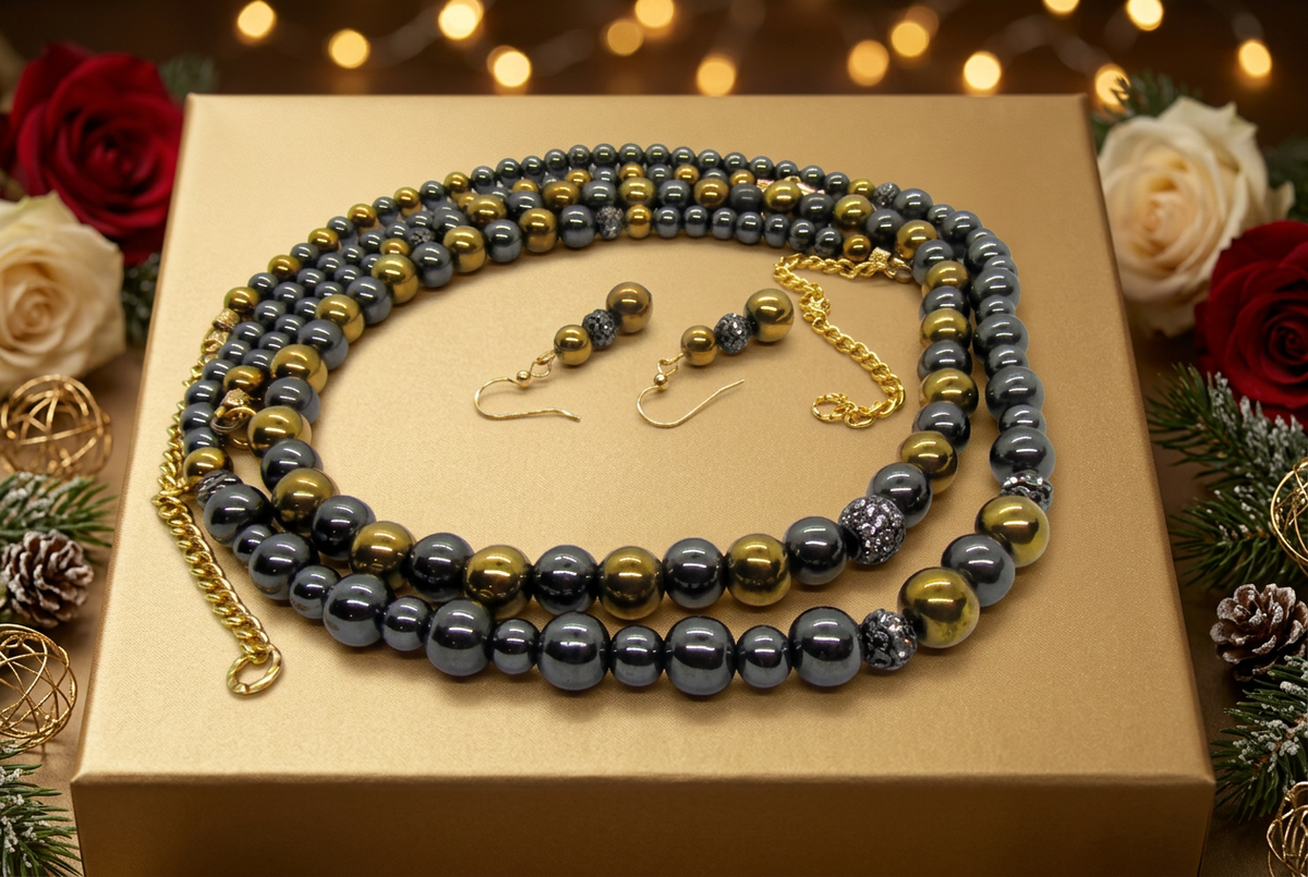 Jewelry on a gold Christmas gift box with festive flowers and soft spotlight
