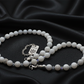 Necklace on flowing black satin