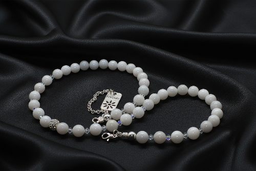 Necklace on flowing black satin
