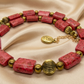 Necklace on soft gold satin with flowing waves