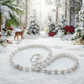 Necklace on sparkling snow in a Christmas forest