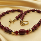 https://www.artistryjewelry.net/products/lovely-burgundy-surprise-necklace