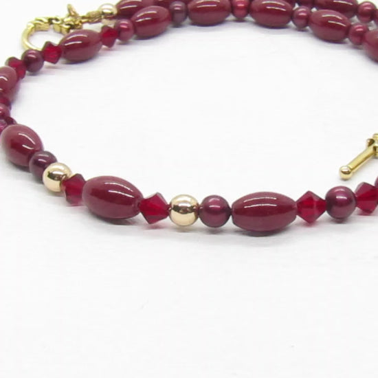 https://www.artistryjewelry.net/products/lovely-burgundy-surprise-necklace
