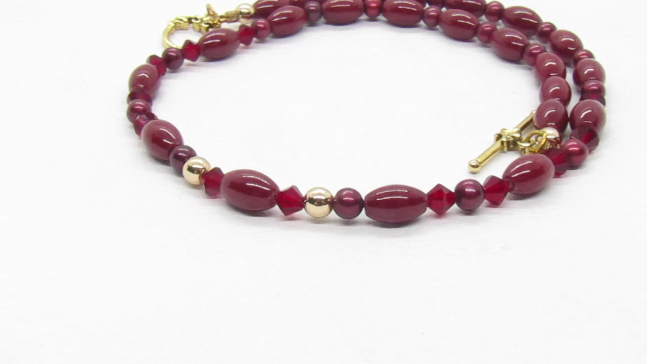 https://www.artistryjewelry.net/products/lovely-burgundy-surprise-necklace
