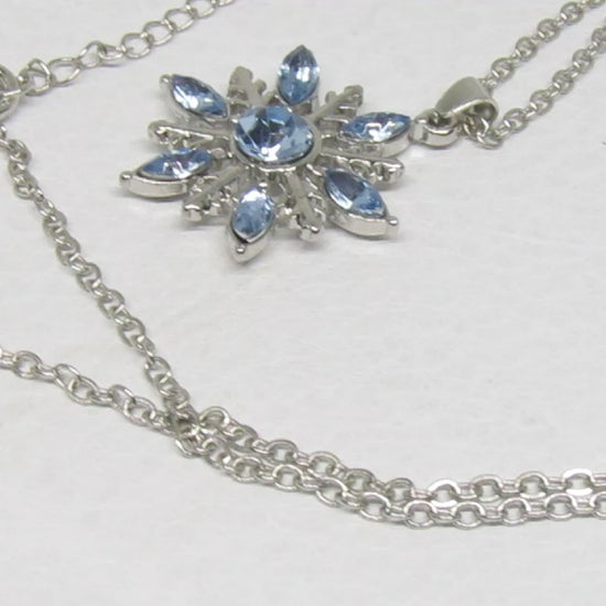 https://www.artistryjewelry.net/products/lovely-blue-winter-snowflake-necklace