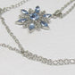 https://www.artistryjewelry.net/products/lovely-blue-winter-snowflake-necklace
