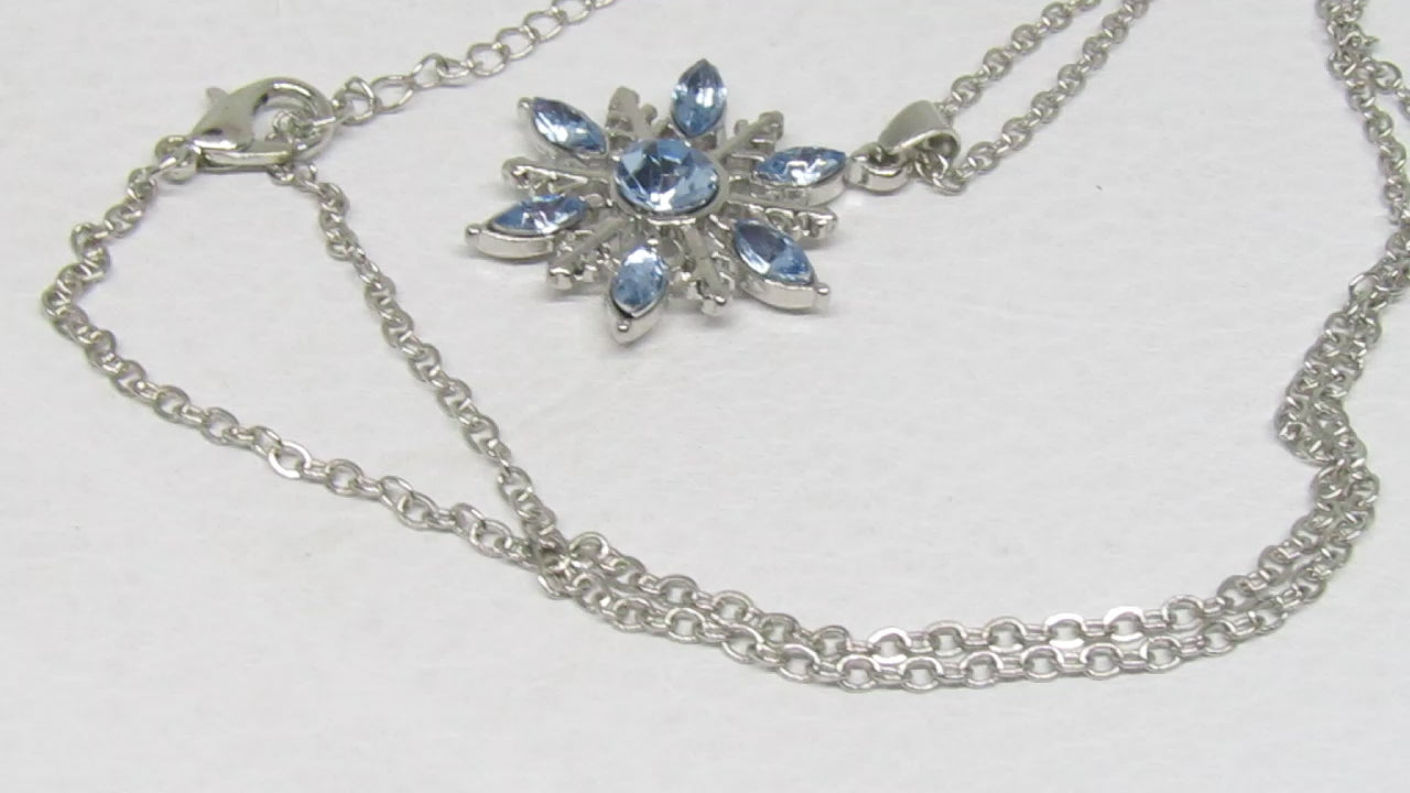 https://www.artistryjewelry.net/products/lovely-blue-winter-snowflake-necklace