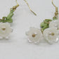 https://www.artistryjewelry.net/products/precious-white-flower-dangle-earrings