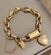 https://www.artistryjewelry.net/products/exciting-puffy-gold-heart-charm-chain-bracelet