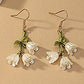 https://www.artistryjewelry.net/products/precious-white-flower-dangle-earrings