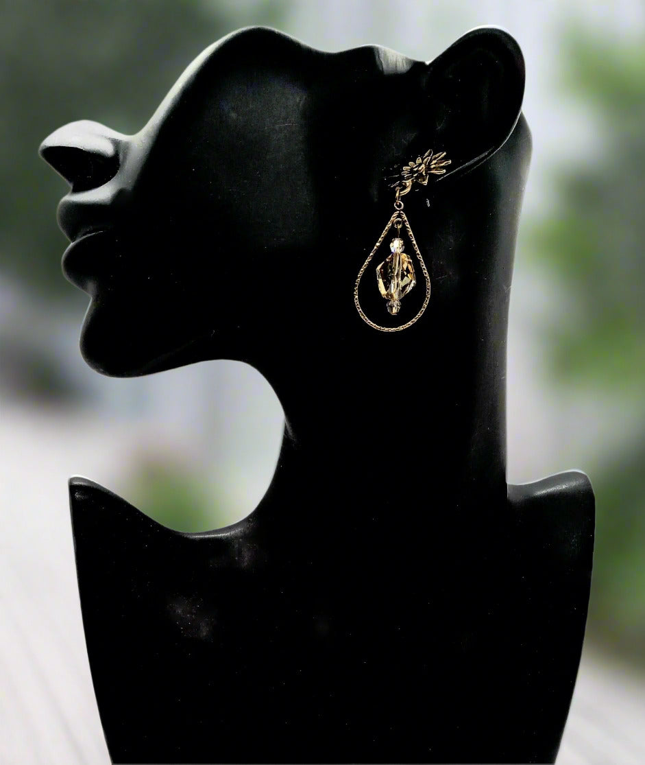 https://www.artistryjewelry.net/products/swarvorski-golden-shadow-earrings